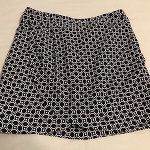 Print short skirt above knee. A wrap look.